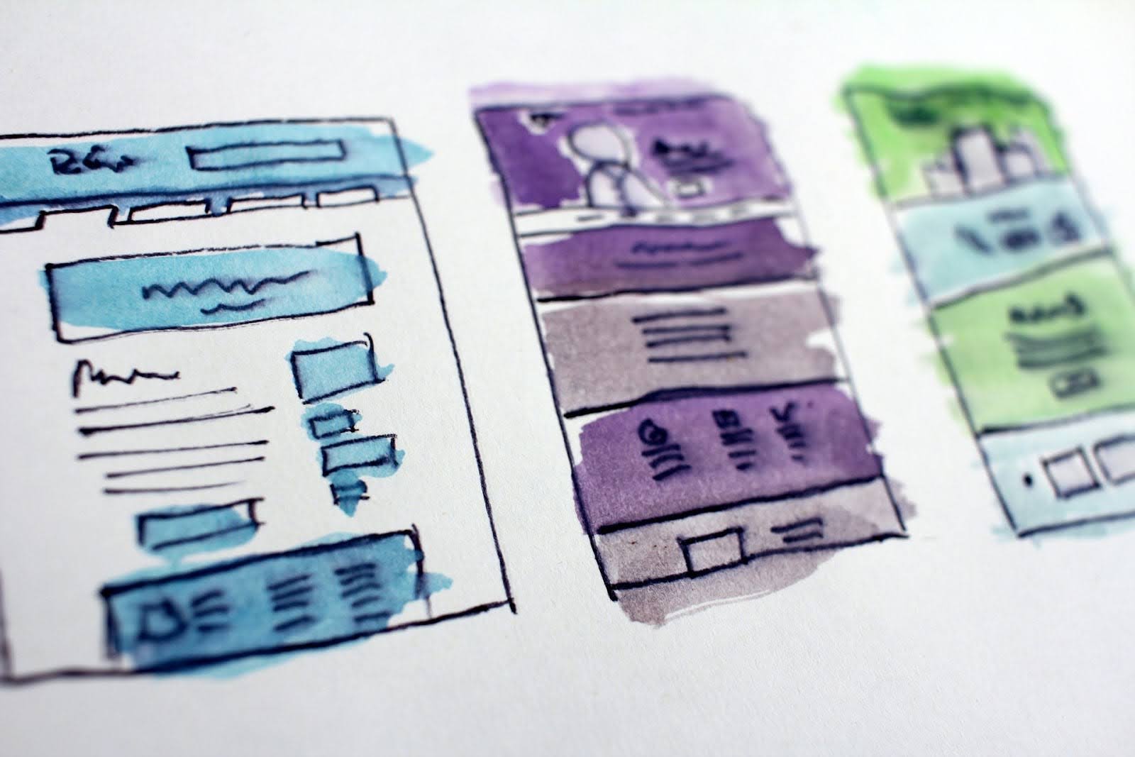 A sketch of three website page designs.