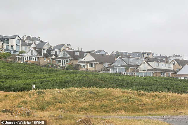 Huge numbers of Brits have fled London to Ogmore-by-Sea (pictured), which was voted the number one WFH location after experts crunched data on homes, connectivity and countryside access