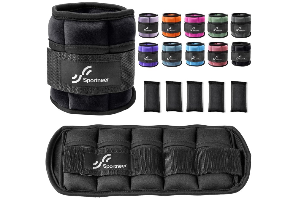 A group of weights and wrist wraps.