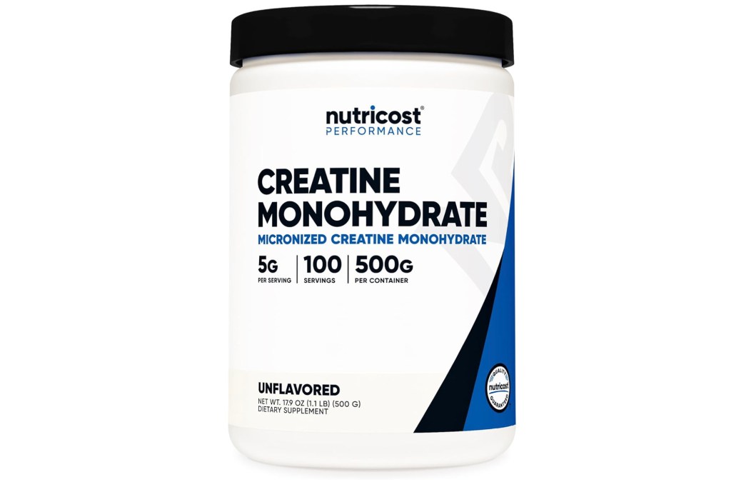 A white plastic container with black lid labeled as creatine.