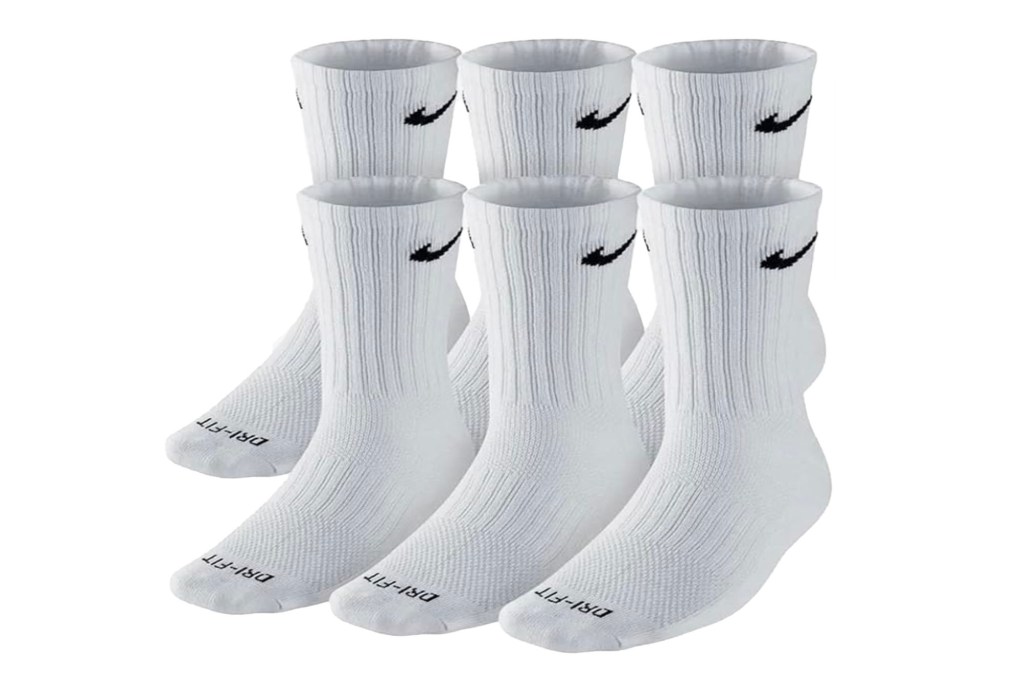 A group of white socks with black Nike logo.