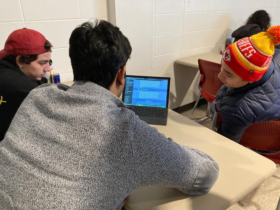 Iowa State University students Jonah Vancil, a sophomore at left, Humza Maqsood, a freshman at center, and Nate Hasso, a freshman at right, work with ChatGPT in an English class on Friday, Jan. 27, 2023. The university is among schools and colleges across the country grappling with how to help students and faculty realize benefits of the recently launched artificial intelligence system and others like it while preventing academic dishonesty.