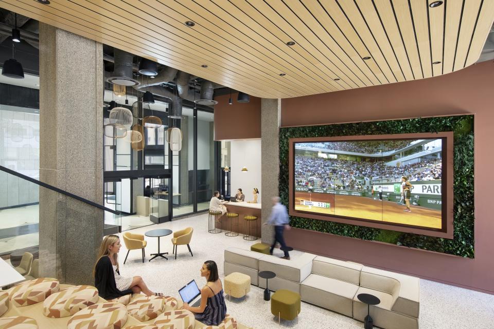 The ground floor of Buccini Pollin Group's 1000 N West building, better known as the Brandywine Building, offers amenities such as collaborative spaces and stadium seeting for video screenings.