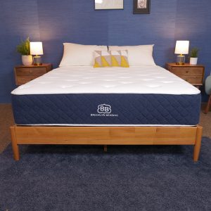 Brooklyn Bedding Signature Hybrid mattress in a bright, modern bedroom.