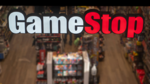 The logo for GameStop Corp (GME) is displayed above a retail storefront entrance.