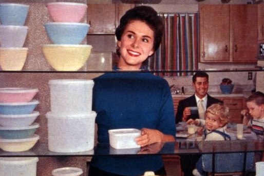 A Tupperware advertisement showing a 50s woman looking at a shelf of Tupperware.