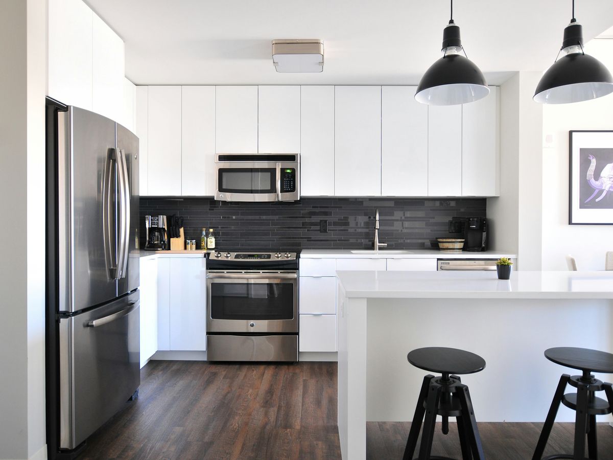 gray steel 3-door refrigerator near modular kitchen