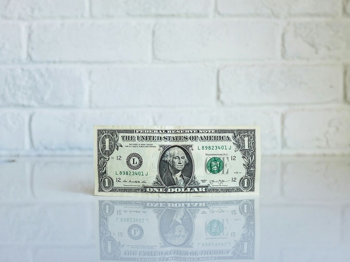 1 U.S. dollar banknote on white surface