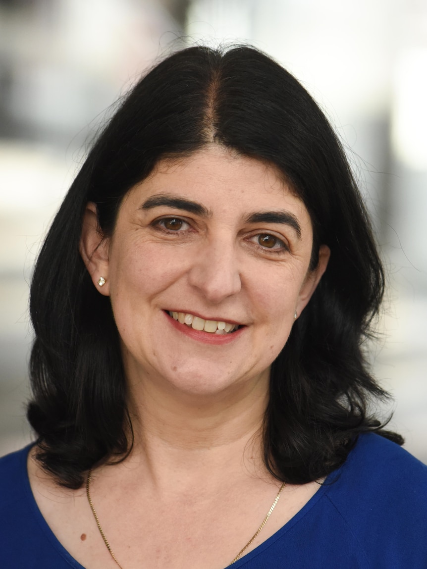 A female nutrition expert smiling at the camera 