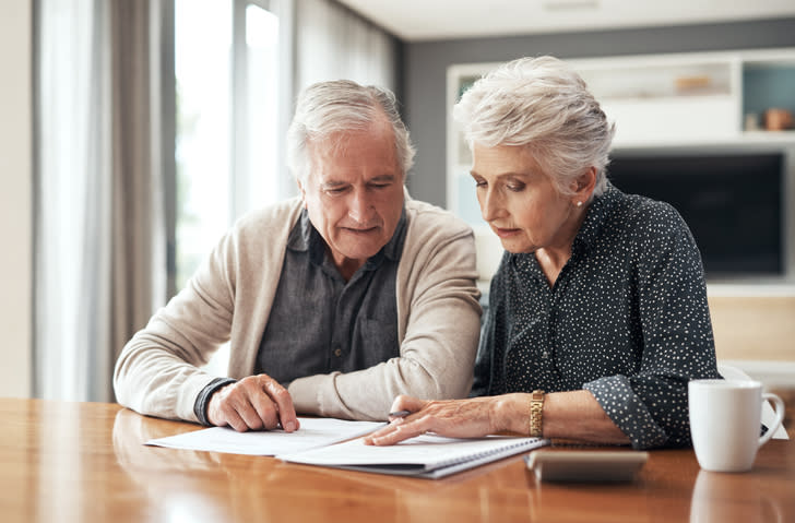 A senior couple reviewing their advance healthcare directive.