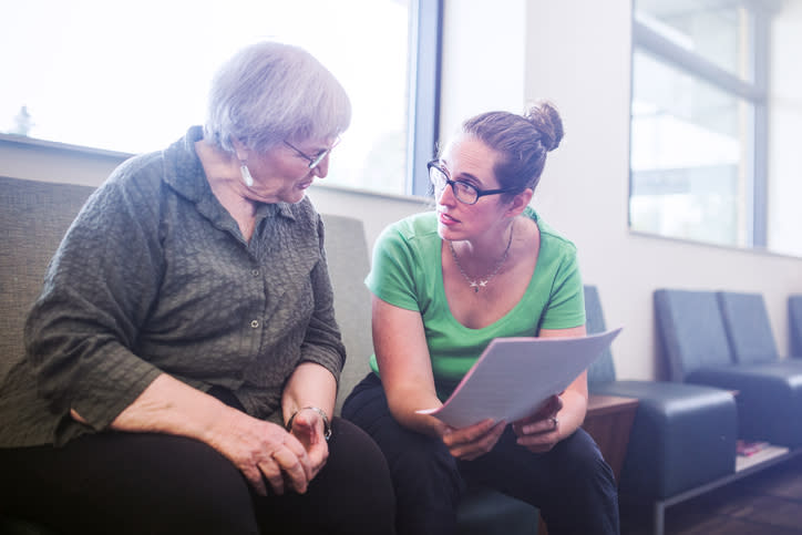 A senior getting information about the portability of her advance healthcare directive.