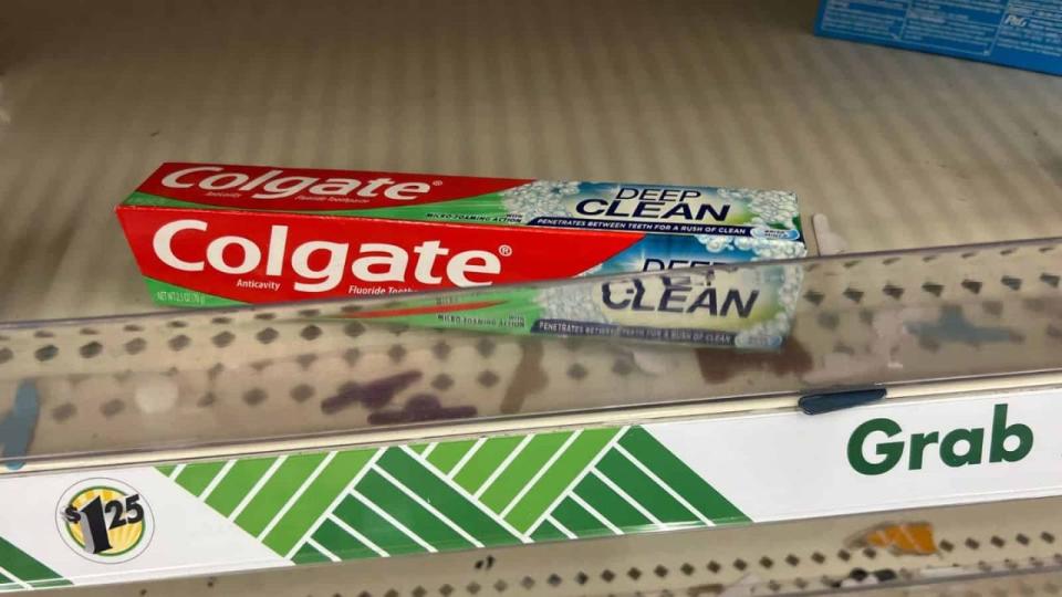 Single box of toothpaste on Dollar Store shelf