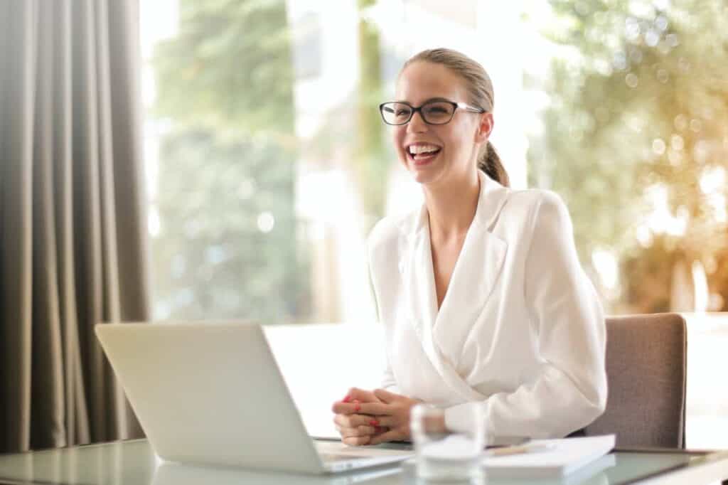 woman working on computer smiling