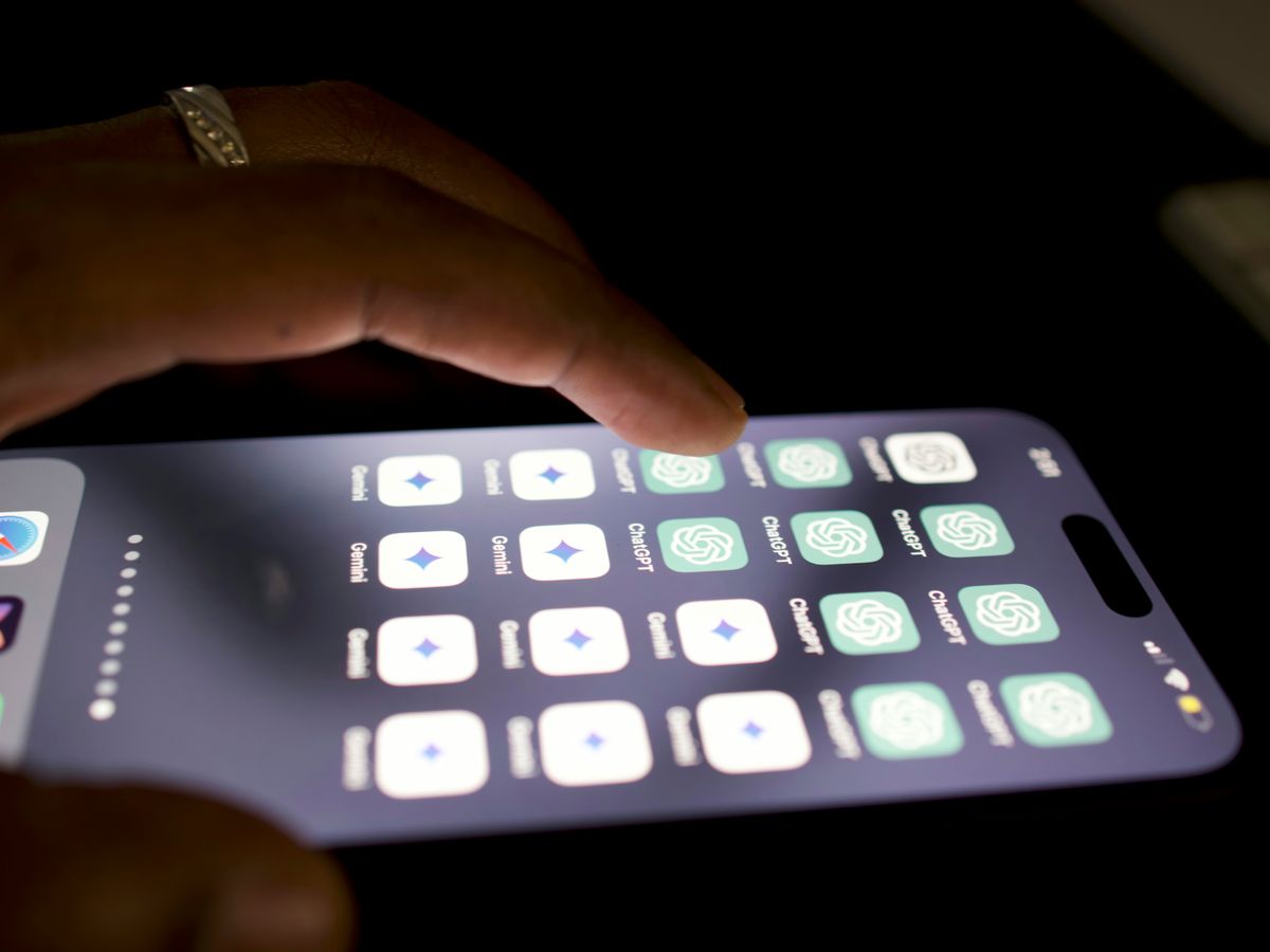 a close up of a person touching a cell phone