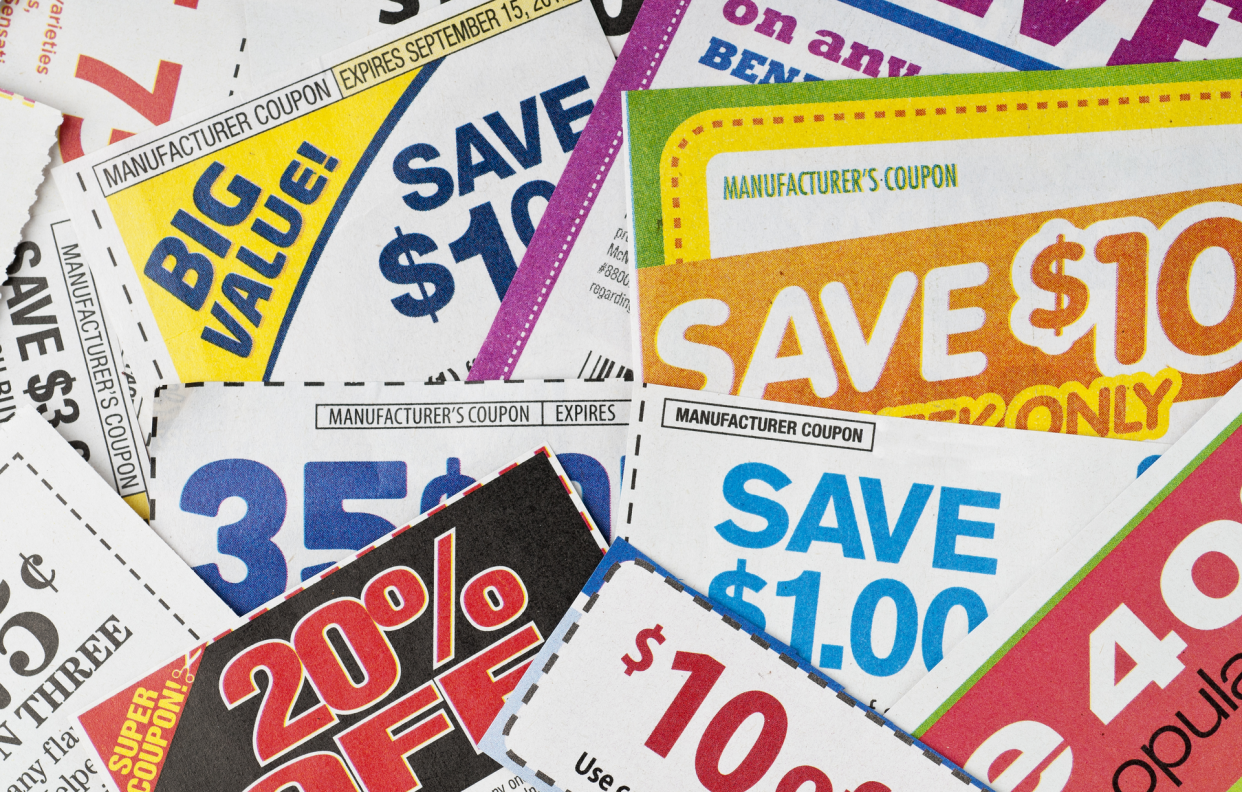 Pile of Clipped Manufacturer Coupon From Newspapers