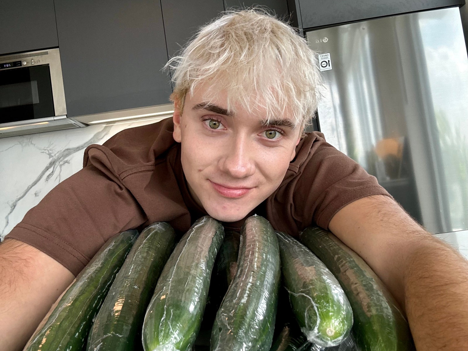 Image may contain Food Plant Produce Squash Vegetable Person Teen and Zucchini