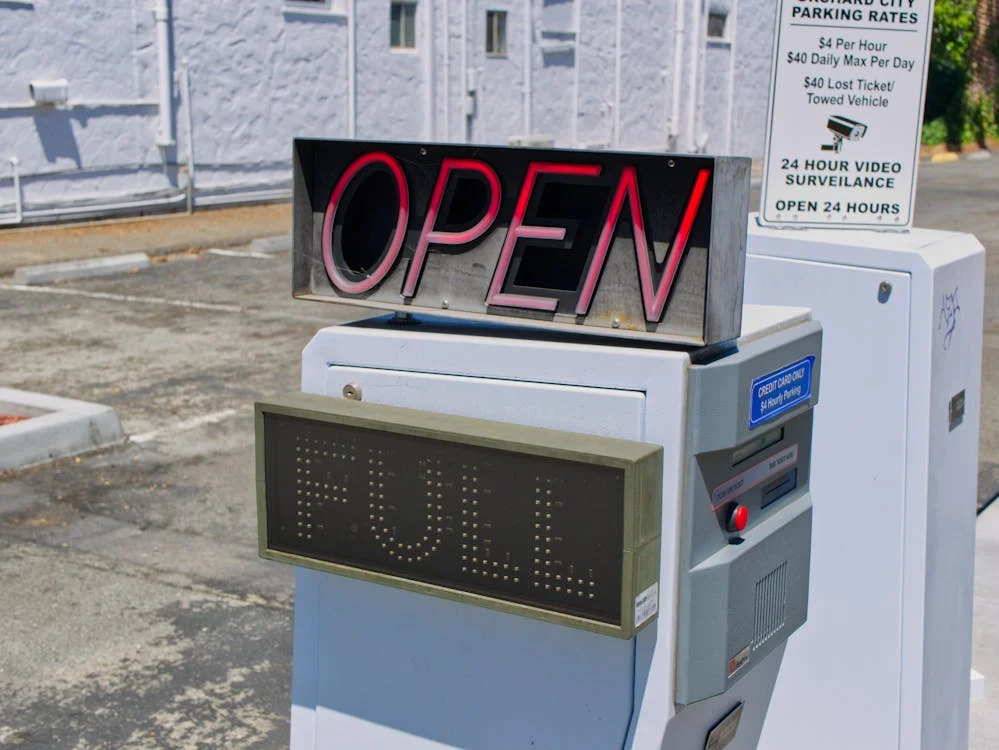 A parking lot sign displays 