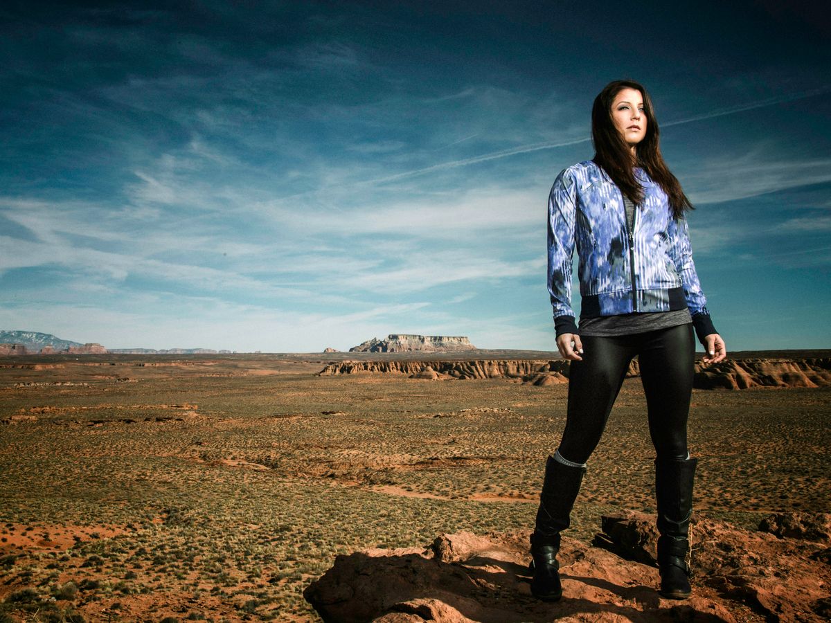 woman standing on brown soil