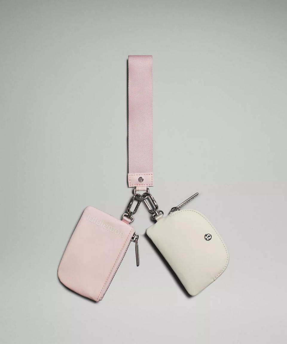 pink and white pouches on a chain