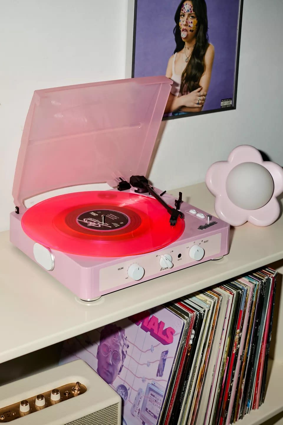 pink and white record player with vinyl spinning