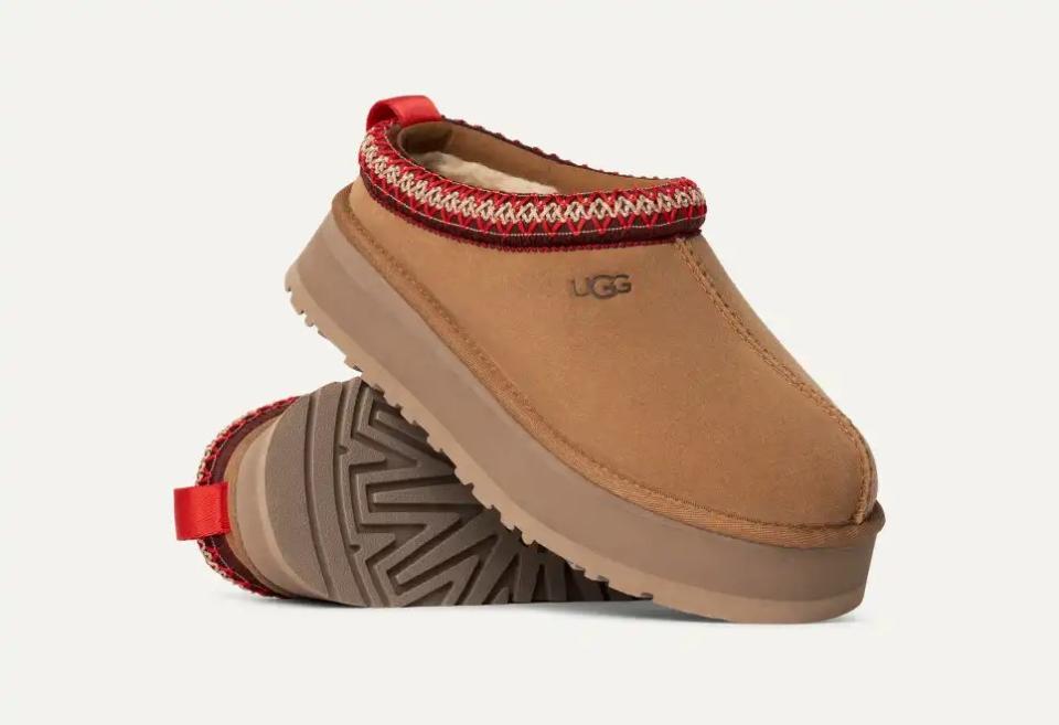 brown slippers with red and yellow stitch hem