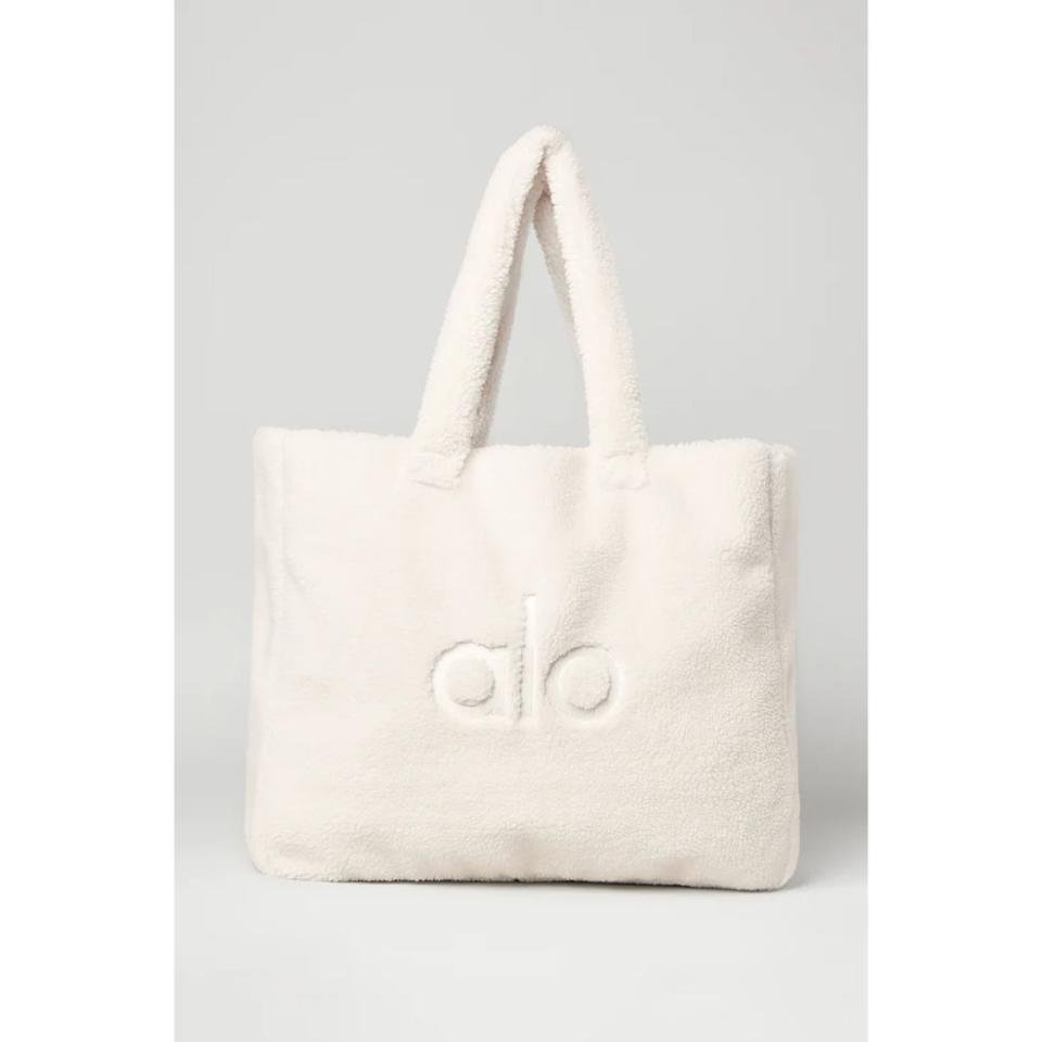 white sherpa tote with alo logo across center